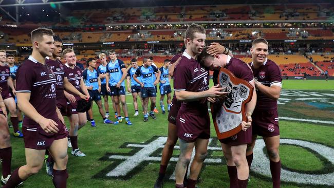 Sam Walker hugs captain Joshua James after the win in the Under 18 Queensland V NSW State of Origin game at Suncorp Stadium in Brisbane. Pics Adam Head