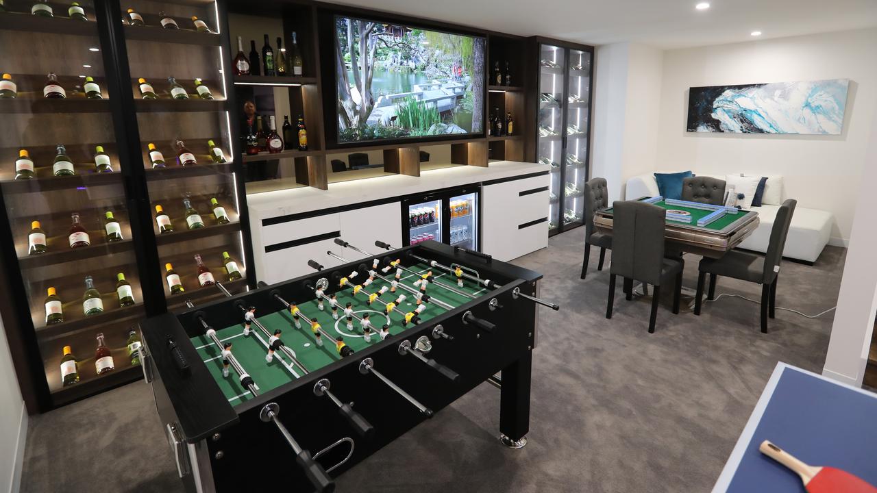 A games room with a full-stocked bar, and foosball, mahjong and ping pong tables, is also part of the package. Picture: Alex Coppel