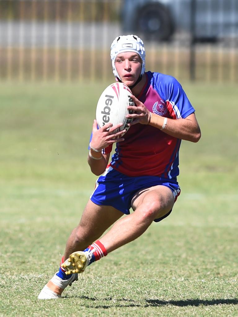 Boys Rugby League State Championship held at Northern Division, Brothers Leagues ground, Townsville. 16-18 years. Peninsula (stripe) v Darling Downs (blue/purple). Braithen Scott of St Mary's College, Toowoomba.