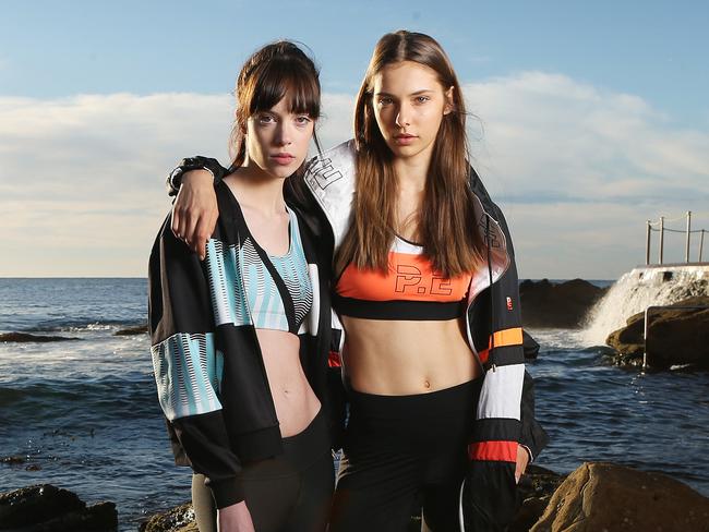 Embargoed for the Saturday Daily Telegraph. Two models in activewear, wearing PE Nation (Kimberley de Vocht, orange) and We Are Handsome (Ashlee Alland, blue), story on fashion week showing activewear, pictured at Bronte beach.