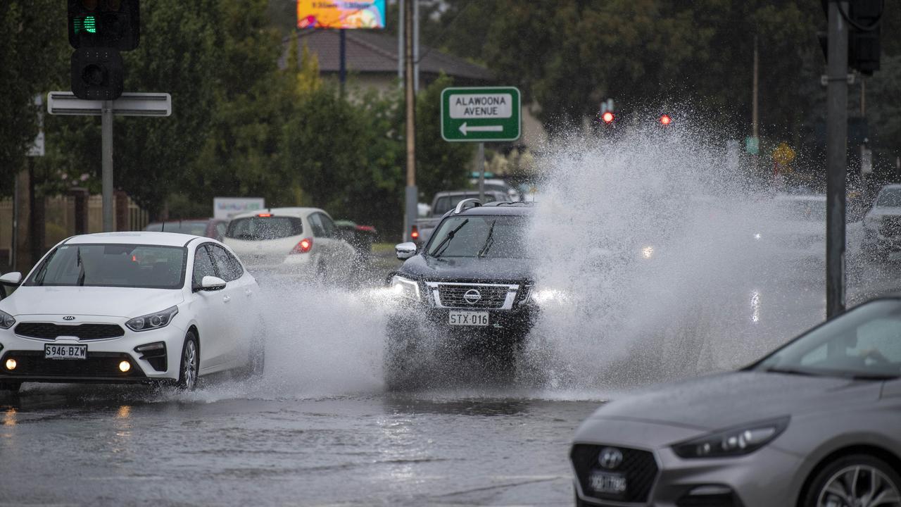 Traffic along Marion Rd, near the Finnis St intersection, battled flooding. Picture: Mark Brake