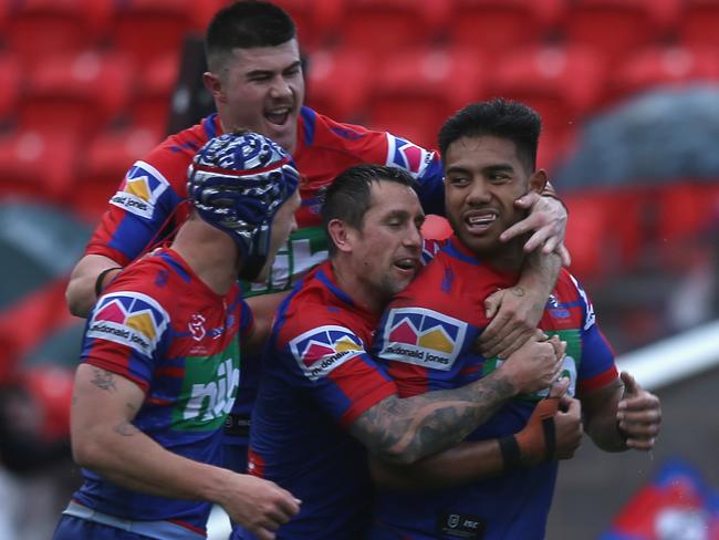 Hymel Hunt is mobbed by teammates. Picture: Ashley Feder/Getty Images