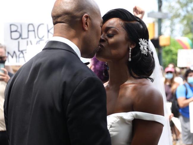 Kerry Anne and Michael Gordon came out to the crowd during a protest, Saturday, June 6, 2020 in Philadelphia over the death of George Floyd, a black man who was in police custody in Minneapolis. Floyd died after being restrained by Minneapolis police officers on May 25. (Tyger Williams/The Philadelphia Inquirer via AP)