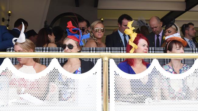 Punters in the Birdcage on Melbourne Cup Day at Flemington Racecourse in Melbourne. Picture: AAP/Tracey Nearmy