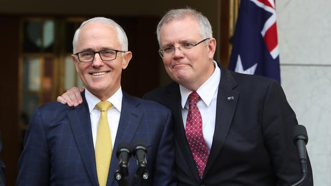 The friendly but fatal Scott Morrison arm on Malcolm Turnbull last August.   Picture Kym Smith