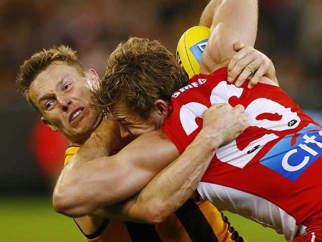 Hawthorn v Sydney Sam Mitchel tackles Luke Parker 3rd term Picture:Wayne Ludbey