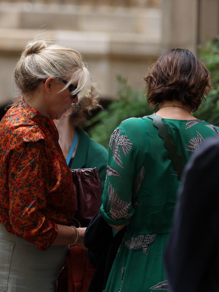 Many who attended the service at St Andrews Cathedral did the same. Picture: NCA NewsWire / Dylan Robinson