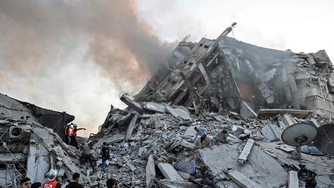 Gaza City’s Al-Sharouk tower in ruins after being hit by an Israeli airstrike on Wednesday. Picture: AFP