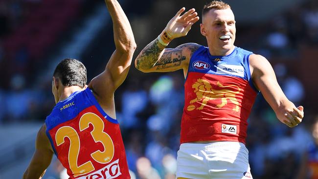 Charlie Cameron and Mitch Robinson celebrate a goal. Picture: Mark Brake/Getty Images