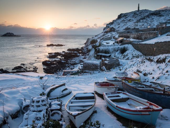 The sun sets as snow covers fishing boats left at Priest’s Cove at Cape Cornwall near Penzance on February 28, 2018 in Cornwall, England. Freezing weather conditions dubbed the “Beast from the East” has brought snow and sub-zero temperatures to many parts of the UK. Amber warnings are in place in northern England, the East Midlands, London, the d south-east of England. Scotland’s weather warning has been upgraded to red, which meansby. Picture: Getty Images