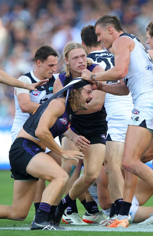 Tempers flare after Lachie Fogarty’s hit. Picture: Sarah Reed/AFL Photos