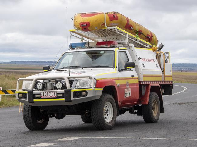 QFES swift water rescue teams on Clifton Road where a man lost his life in flood waters at North Branch. Tuesday, March 29, 2022. Picture: Nev Madsen.