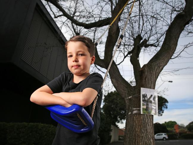 Rafi Ezekial, 7, pleaded with authorities to let him keep the tree swing at his grandparents’ Brighton East home after Bayside Council ordered it to be removed. Picture: Mark Stewart