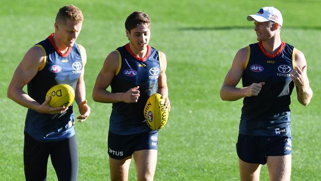 Reilly O'Brien, left, with teammates Jake Kelly and Alex Keath at Crows training.