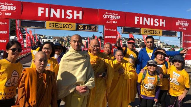 Bhante Jason Chan, centre, leading the 39 walkers of Pal Buddhist School at this year's fun-run. The 5 hour time they clocked was a whole hour slower than they planned.