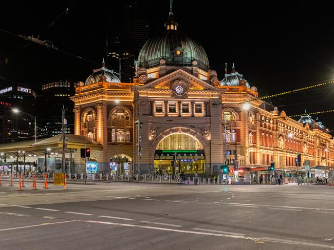 An empty Flinders Street and Flinders Street station in Melbourne, which is usually bustling with people on every day of the week. Picture: Asanka Ratnayake/Getty