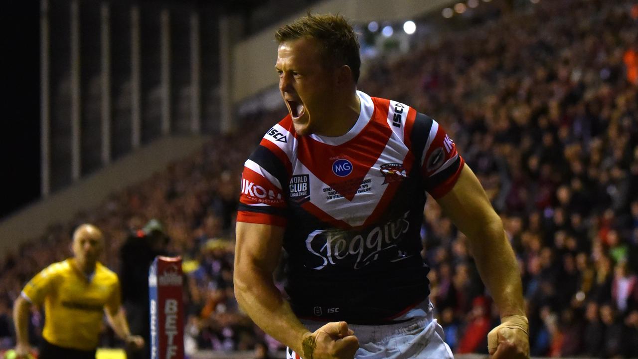 Brett Morris of Sydney Roosters celebrates as he scores their first try during the World Club Challenge against the Wigan Warriors.
