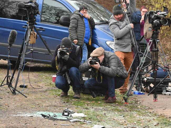 News media film broken glass and car parts on the road side near to the Sandringham Estate, England, where Prince Philip was involved in a road accident. Picture: AP