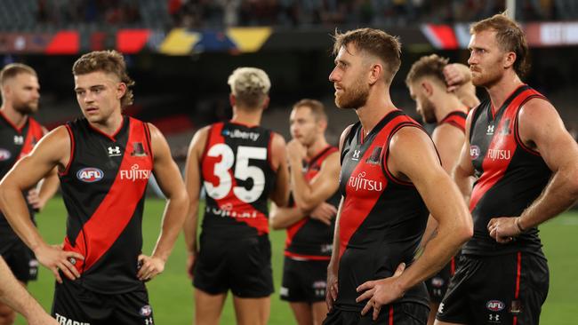 Dejected Bombers after they were defeated by 22 points at Marvel Stadium. Picture: AFL Photos/via Getty Images