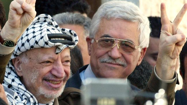 PLO leader and KGB asset Yasser Arafat, left, with his successor Mahmoud Abbas in the West Bank in 2003. Picture: AP