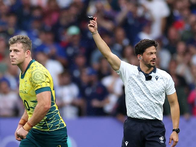 PARIS, FRANCE - JULY 27: Nick Malouf of Team Australia is shown a red card by Referee Jeremy Rozier during the MenÃ¢â¬â¢s Rugby Sevens Bronze Medal match between Team South Africa and Australia on day one of the Olympic Games Paris 2024 at Stade de France on July 27, 2024 in Paris, France. (Photo by Cameron Spencer/Getty Images)