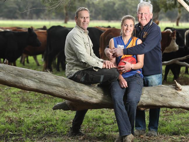 Casey McElroy, 27, has the support of her family, including dad Bradley, 52, and grandfather Jeffrey, 81, after she was dealt a six-week ban from playing women’s football because she played in a men’s team in May. Photo: TAIT SCHMAAL