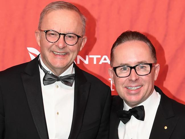 Australian Prime Minister Anthony Albanese (L) stands with Qantas CEO Alan Joyce as they attend the Qantas 100th Gala Dinner at Jetbase 96 hangar at Sydney's International Airport on March 31, 2023 in Sydney, Australia.