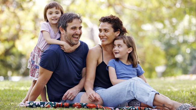 Nic Kirby with wife Syrie Wongkaew and children Gracie (right) and Rose (left) are cautiously welcoming the change. Picture: Sam Ruttyn