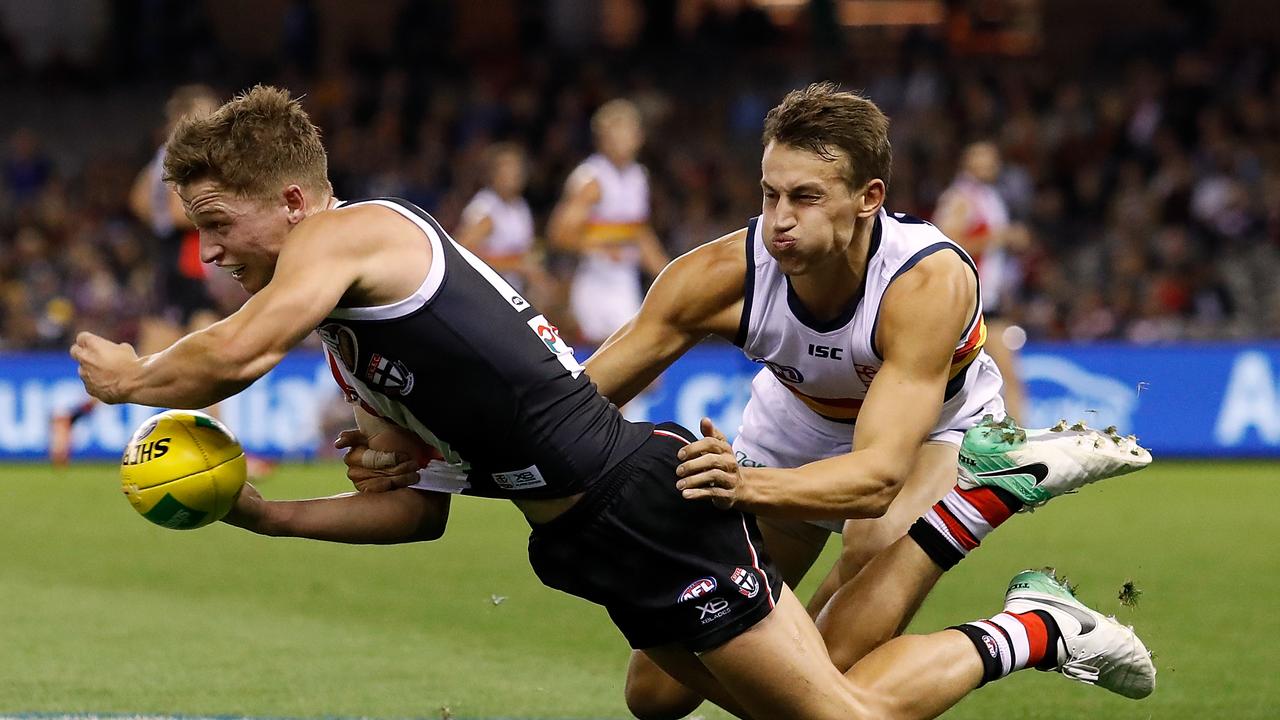 MELBOURNE, AUSTRALIA - APRIL 7: Jack Billings of the Saints is tackled by Tom Doedee of the Crows during the 2018 AFL round 03 match between the St Kilda Saints and the Adelaide Crows at Etihad Stadium on April 7, 2018 in Melbourne, Australia. (Photo by Adam Trafford/AFL Media/Getty Images)