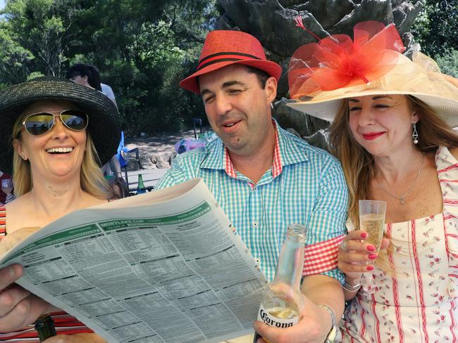 MELBOURNE, AUSTRALIA - NewsWire Photos, NOVEMBER 2, 2021. People gather on Melbourne cup day in Footscray Park across from Flemington race course. L to R Kim Billington, Alekandar Nikolobski and Ellie Vrangalas. NCA NewsWire / David Crosling