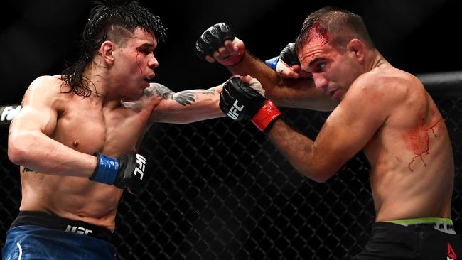 Ricky Simon of the United States punches Rani Yahya of Brazil during their bloody bout. Picture: Quinn Rooney/Getty Images