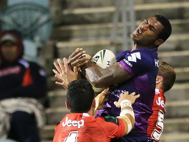 Suliasi Vunivalu takes a bomb to score against the Dragons. Pic: Mark Evans