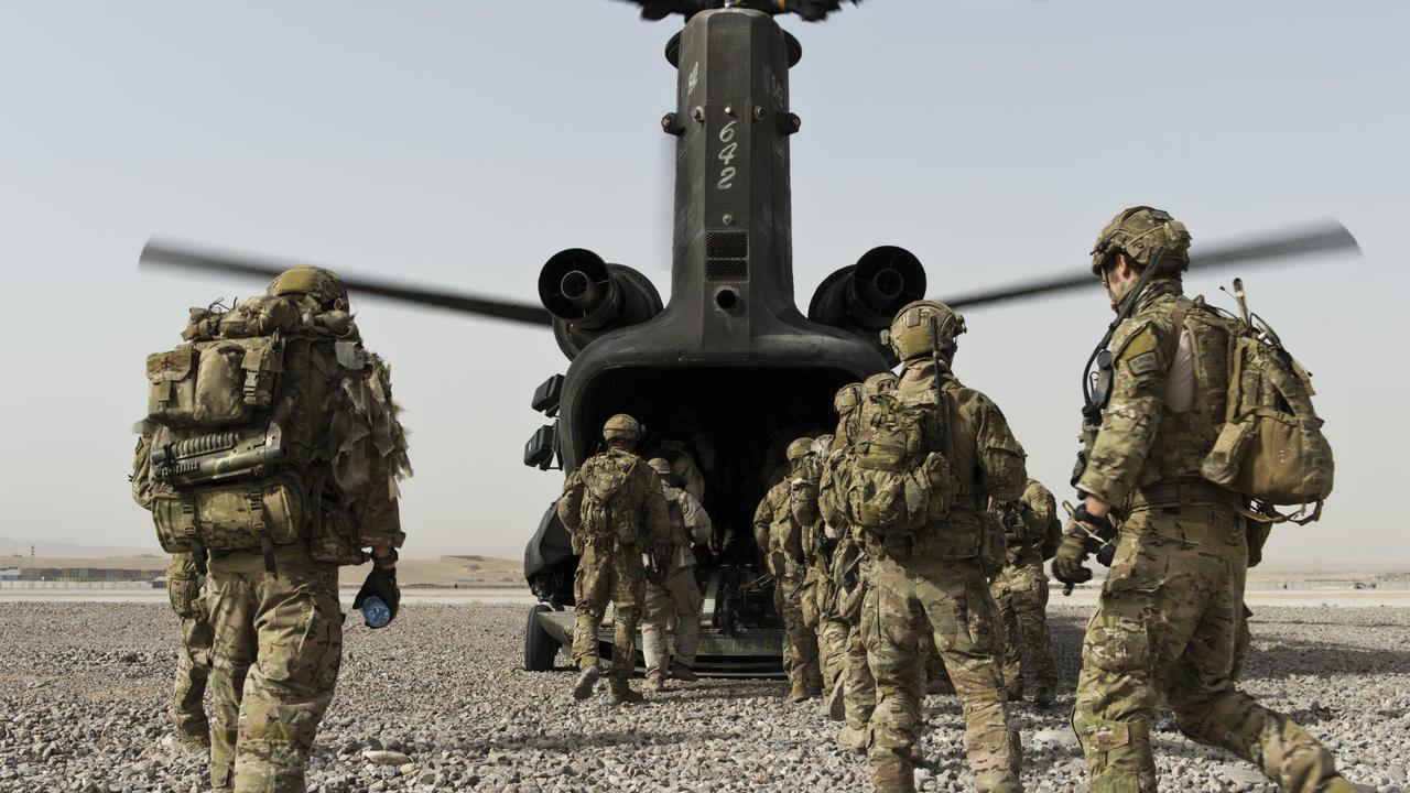 Australian soldiers and their Afghan National Security Force partners board a US Army CH-47 Chinook helicopter at Tarin Kowt, Uruzgan province, southern Afghanistan, in 2012. Eighty per cent of ADF members have a positive experience of their service.