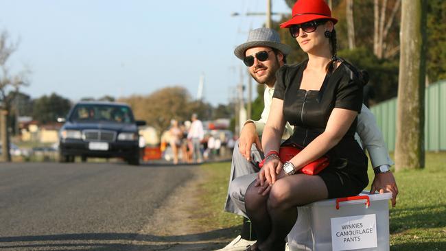 The end of a long day at the Geelong Cup. Chris Young and Jess O'Donnell waiting for a ride.