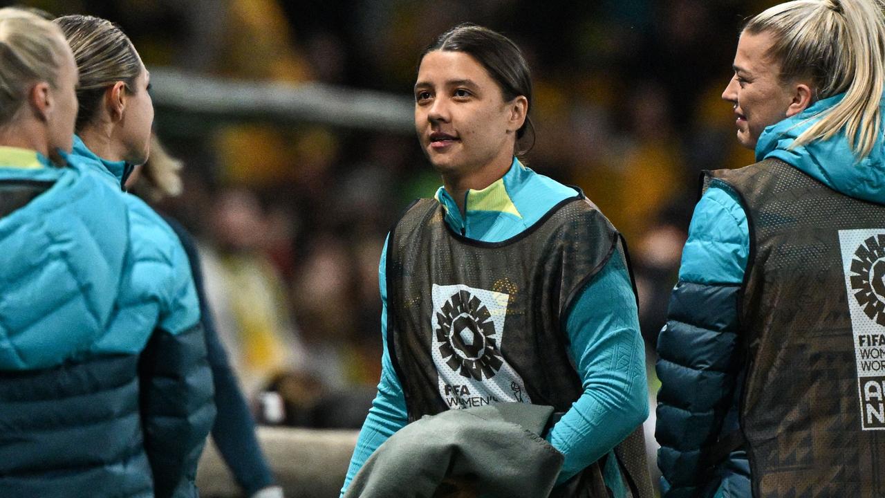 Australia's captain Sam Kerr (C) is seen on the touchline during the Australia and New Zealand 2023 Women's World Cup Group B football match between Canada and Australia at Melbourne Rectangular Stadium, also known as AAMI Park, in Melbourne on July 31, 2023. (Photo by WILLIAM WEST / AFP)