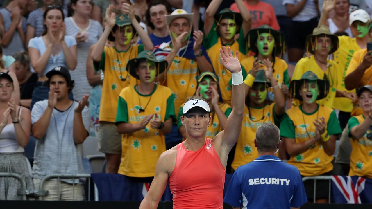 Samantha Stosur waves to the crowd after the defeat. 