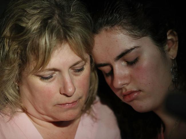 Sarah Crescitelli leans on her mother, Stacy Crescitelli after she escaped the shooting at Marjory Stoneman Douglas High School. Picture: Getty Images/AFP