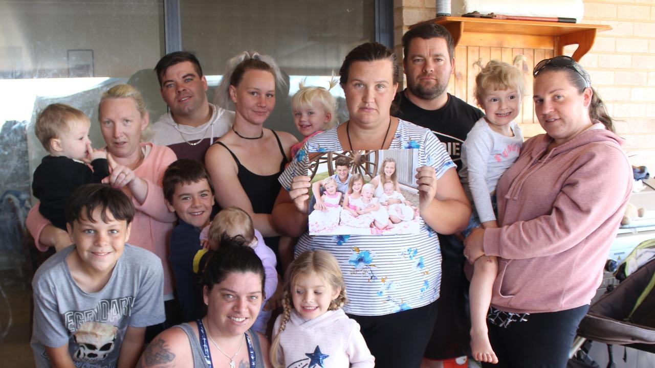 Tyson's mother and father, Lutece Maree (holding photo) and Robert Christensen (black shirt) and their extended family.