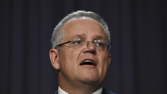 Prime Minister Scott Morrison has revealed the cost to Australia’s health and hospital system from coronavirus could top $1 billion. AAP Image/Lukas Coch