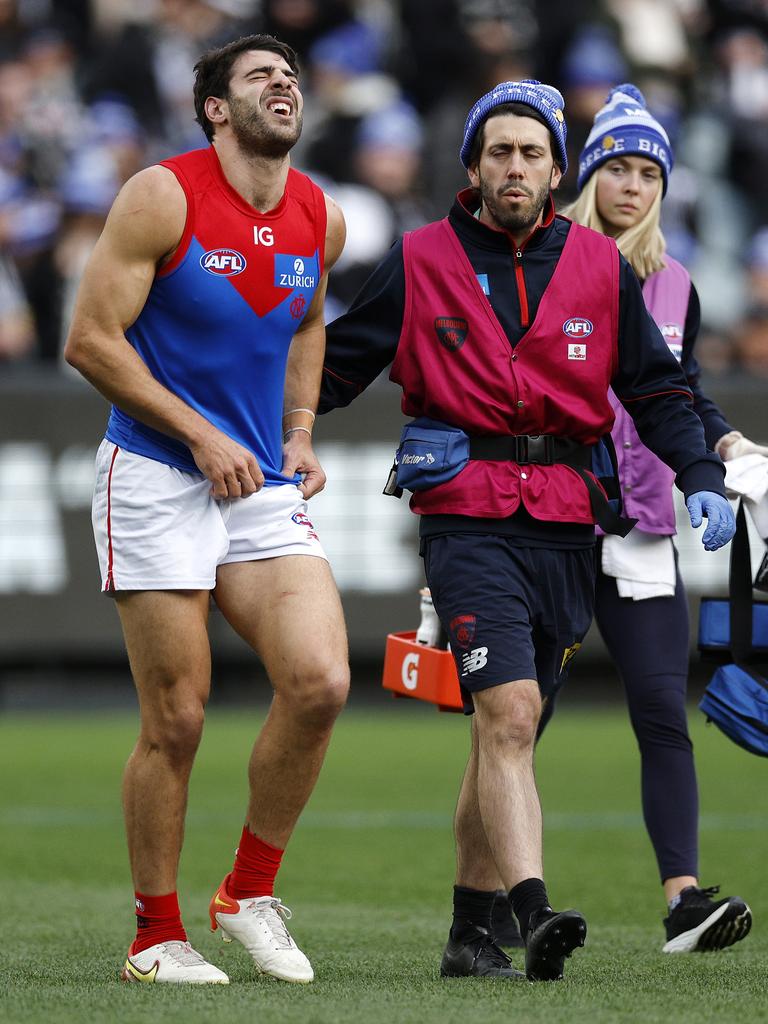 Christian Petracca in pain after being collected by Darcy Moore. Picture: Michael Klein