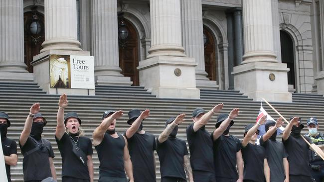 Neo-Nazis performing the Nazi salute on the steps of Victorian Parliament on March 18, 2023. Picture: NCA NewsWire / David Crosling