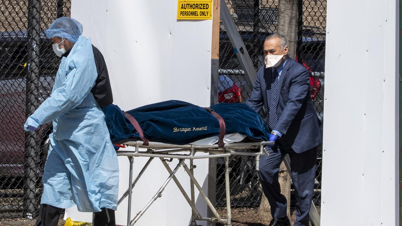 A funeral director and Wycoff Heights Medical Centre employee transport a body. Picture: Mary Altaffer/AP