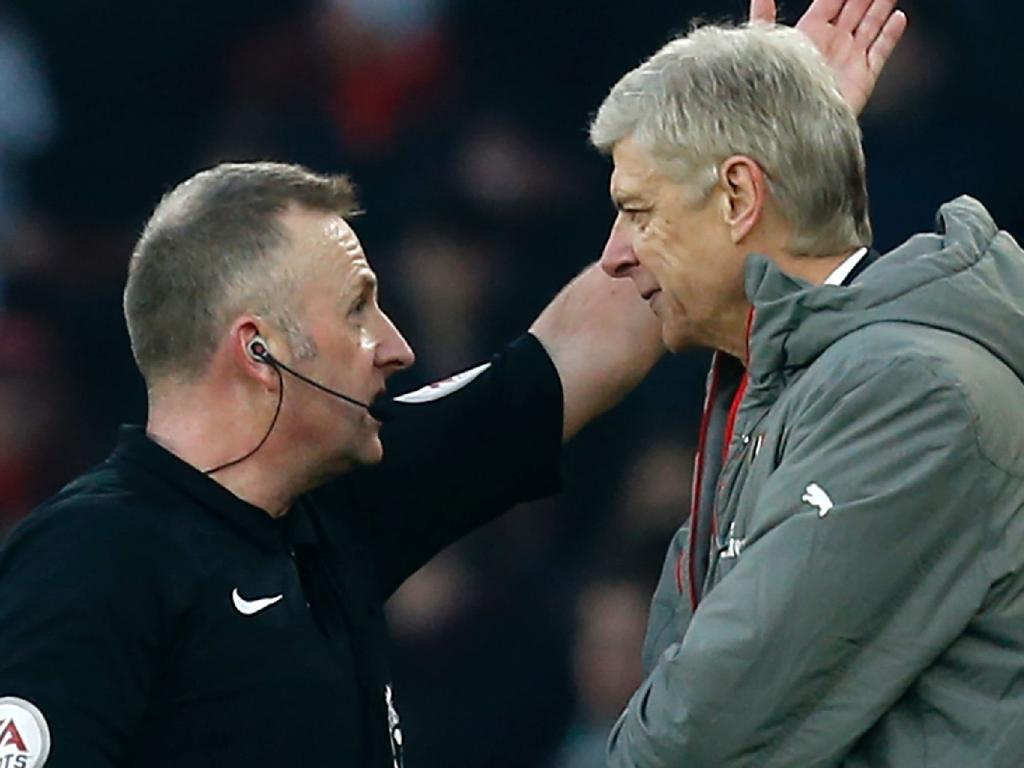 Football Australia’s new Head of Referees Jonathan Moss (L) confronts former Arsenal coach Arsene Wenger during his time as a referee. Picture: AFP