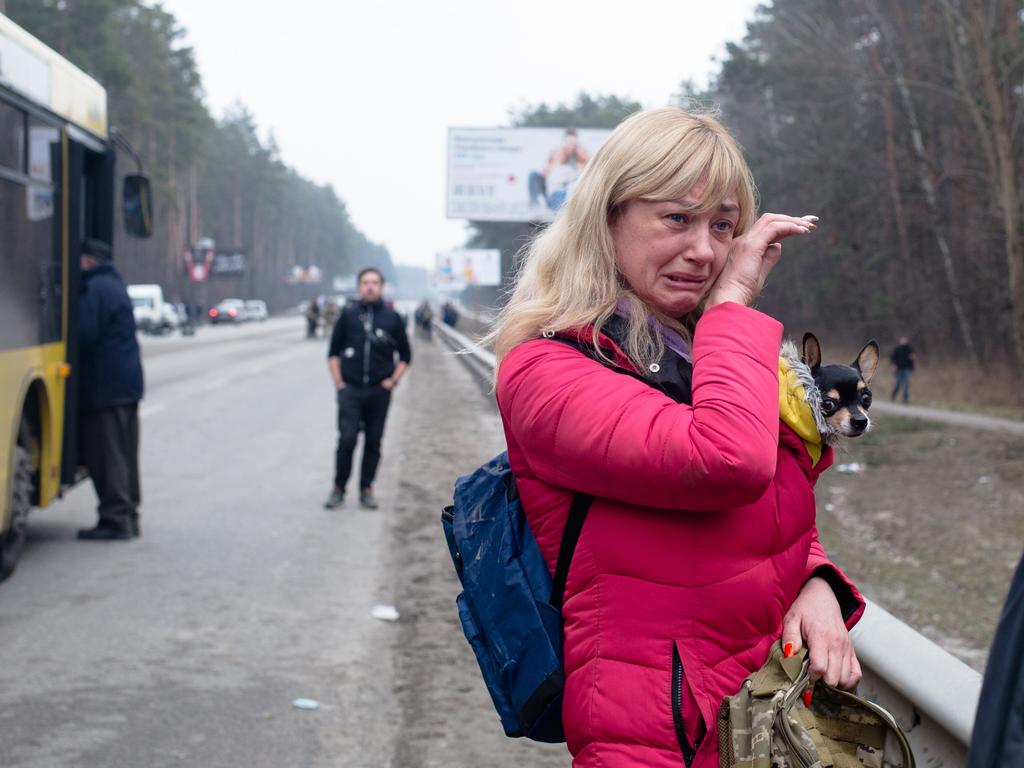 A wife says her goodbyes to her husband who is a member of the Territorial Defence as she evacuates from the city near Irpin, Ukraine. Picture: Getty Images