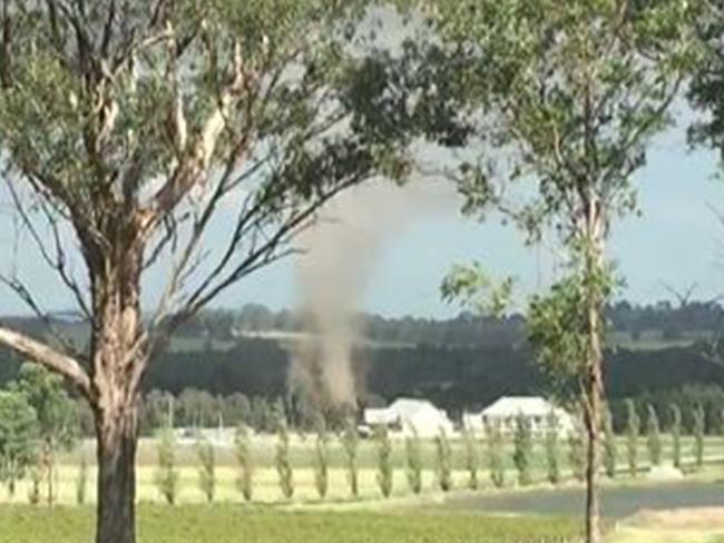An image from a video which captured the moment a weak tornado struck a winery in the Hunter Valley.
