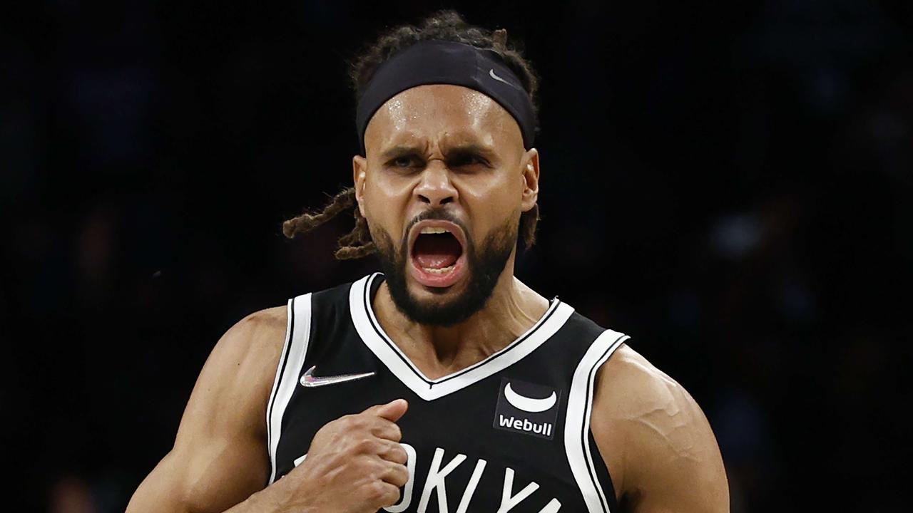 NEW YORK, NEW YORK - DECEMBER 14: Patty Mills #8 of the Brooklyn Nets reacts after making a three-point basket during the second half against the Toronto Raptors at Barclays Center on December 14, 2021 in the Brooklyn borough of New York City. The Nets won 131-129. NOTE TO USER: User expressly acknowledges and agrees that, by downloading and or using this photograph, User is consenting to the terms and conditions of the Getty Images License Agreement. Sarah Stier/Getty Images/AFP == FOR NEWSPAPERS, INTERNET, TELCOS &amp; TELEVISION USE ONLY ==