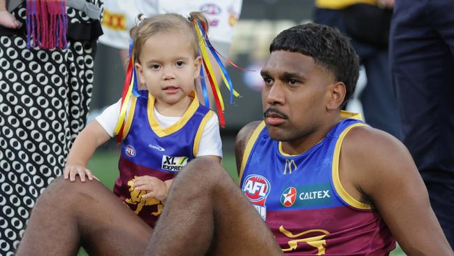 Keidean Coleman is comforted by his daughter after the siren after their grand final loss. Picture Lachie Millard