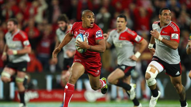 Will Genia of the Reds makes a break during the 2011 Super Rugby grand final.
