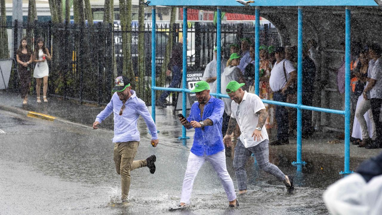 Patrons leave the washed out Magic Millions meeting in January Picture: Richard Walker