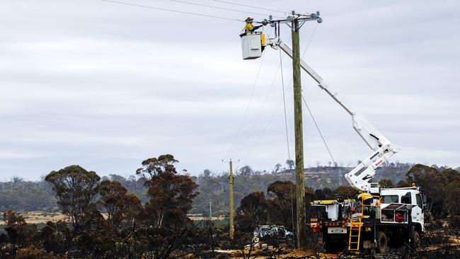 Powerlines being repaired after the summer bushfires. Picture: CHRIS KIDD